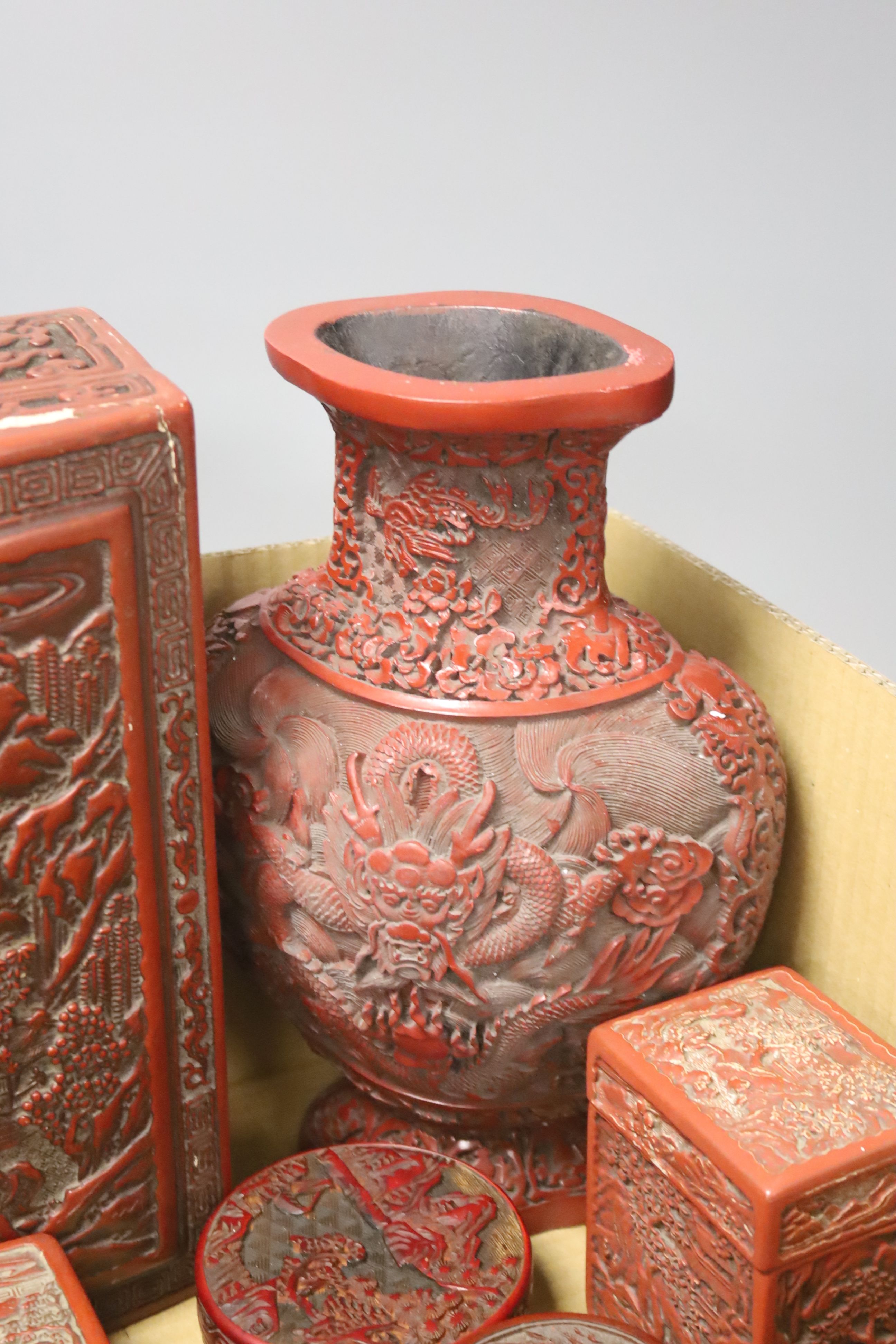 An assortment of Chinese cinnabar lacquer and other later boxes, largest 29 x 10cm